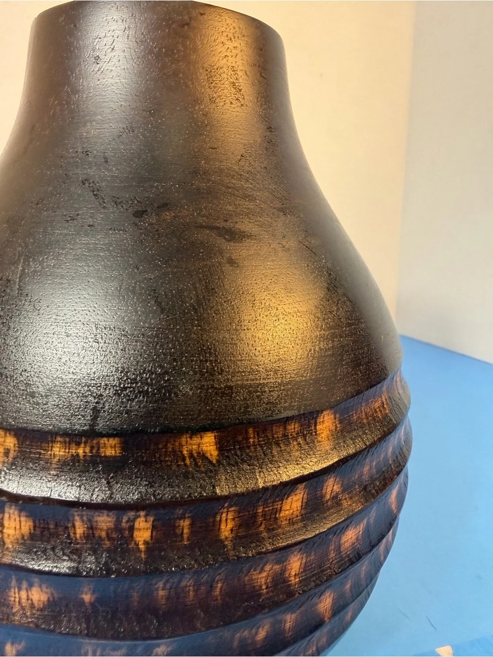 hand-carved wooden vase with contrasting texture